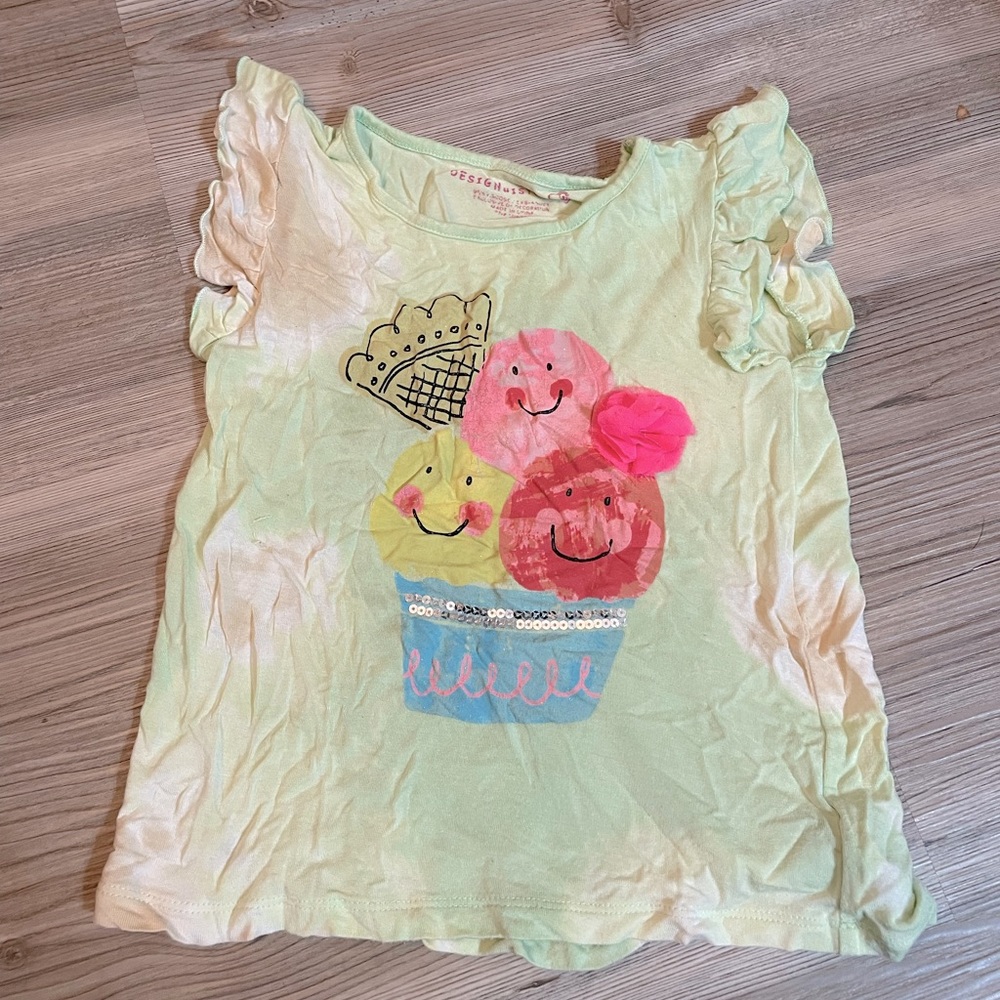 Green tie dyed sleeve less shirt with accents